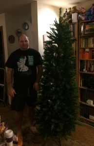 The tree assembled and ready to be decorated the brony (my husband) included for scale.