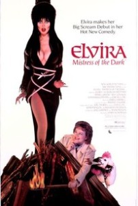 Cover of the DVD release of Elvira, Mistress of the Dark, showing Elvira tied to a stake, while city councilwoman Chastiity Pariah strikes a match.